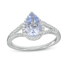 Bring dreamy color to any look when you wear this pear-shaped blue lab-created spinel and white lab-created sapphire frame split shank ring in silver. Fashioned in sterling silver This choice glistens with a 9.0 x 6.0mm pear-shaped light blue lab-created spinel at the center. White lab-created sapphires line the halo frame and the ribbons of the split shank for added shimmer. Blue Pear-shaped Jewelry With Accent Stones, Elegant Teardrop Ring With Gemstone Accents, Elegant Teardrop Rings With Gemstone Accents, Elegant Blue Pear-shaped Ring, Blue Pear Shaped Jewelry With Prong Setting, Blue Pear Shaped Prong Set Jewelry, Blue Pear-shaped Jewelry With Prong Setting, Blue Teardrop Elegant Rings, Elegant Blue Teardrop Rings