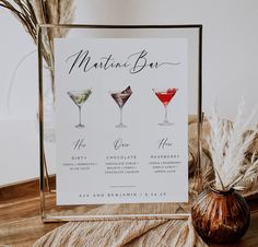 the martini bar menu is displayed on a table