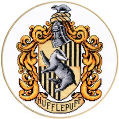 a cross stitched harry potter crest