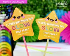 two yellow star shaped lollipops with i loved watching you glow on them