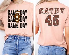 Personalized Football Game Day Shirt, Child Name & Number Football Game Season Shirt, Game Day Sports Tee, Custom Game Day Mom Football Tee --- HOW TO ORDER --- 1 - Please make sure you have read and looked at all sizes and chosen the color that best suits you. 2 - Select from the various T-shirt sizes. 3 - Select from the various T-shirt color. 4 - ADD your personalized design/text color or text in the box IF provided. 6 - Add to cart. ---PRODUCTION AND SHIPPING--- - Your order will be ready to ship next business day. - First Class Mail (2-5 Business Days) - Priority Mail (1-3 Business Days) - Express Mail (1-2 Business Days) --- CARE INSTRUCTIONS --- - Machine wash cold, inside-out, gentle cycle with mild detergent and similar colors.  - Use non-chlorine bleach, only when necessary. No f Sports Tee, Football Tee, Personalized Football, Design Text, Football Tees, Game Day Shirts, Sports Tees, Football Game, Football Games