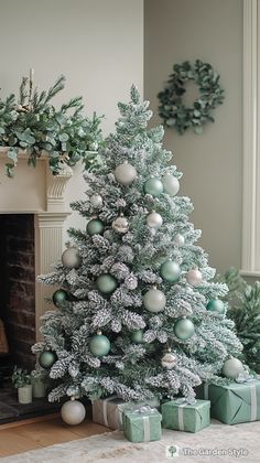 a decorated christmas tree in front of a fireplace