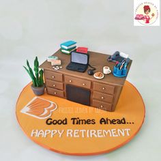 there is a cake that says good times ahead happy retirement on the table with office supplies