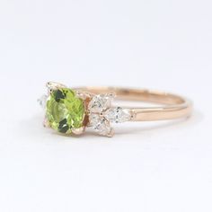 --- Handmade in the United States--- Made to Order--- Metal: Solid 14K Gold ( White Gold, Rose Gold, Yellow Gold )--- Center Stone: 6 mm Natural Diamond Cut Peridot (Approx:0.85ct)--- 100% Real Natural Diamond--- Non-Conflict Diamonds--- Diamond Shape: Marquise--- Diamond Cut Grade: Very Good--- Diamond Cutting Style: Brilliant Cut--- Diamond Color: G (White)--- Diamond Clarity: VS2-SI1 (Eye Clean)--- Diamond Quantity: 6--- Diamond Size: 4x2 mm--- Diamond Total Carat Weight: 0.48 ct◈ 18K & Plati Peridot Engagement Ring, Peridot Engagement Rings, Marquise Diamond Ring, Opal Wedding Rings, Engagement Rings Marquise, Marquise Cut Diamond, Diamond Wedding Ring, Peridot Ring, Green Peridot