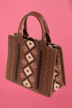 A stunning piece that is sure to turn heads, this hand bag shows off a distinctive boho western pattern square bag design. This hand bag is the perfect way to add a touch of elegance to any outfit. Length: 10 Inches Depth: 4.5 Inches Height: 8.5 Inches 100% Polyester. Brown Tote Box Bag With Adjustable Handle, Brown Square Satchel With Handles, Brown Rectangular Satchel With Handles, Brown Square Bag With Handles, Bohemian Shoulder Bag With Large Capacity For On-the-go, Bohemian Bags With Adjustable Strap, Bohemian Brown Satchel For On-the-go, Brown Square Satchel For On-the-go, Bohemian Bags With Adjustable Strap For On-the-go