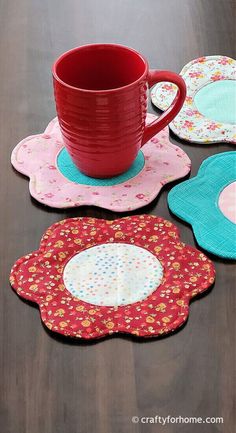 four placemats and a cup on a table