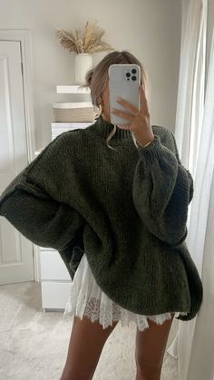 Oversized sweater outfit, cozy fall aesthetic, chunky knit with boots, olive green knit sweater, lace skirt layering, minimalist autumn style, statement boots outfit, casual chic knitwear, sweater and boots combo, neutral home mirror selfie, effortless fall fashion, boho knit and lace, autumn outfit inspo, soft neutral tones, relaxed chic style, trendy oversized look, cozy home aesthetic, modern feminine style, oversized sweater dress, lace and knit contrast, Scandinavian-inspired outfit, classic fall layering, textured knit fashion, laid-back fall vibes Home Mirror Selfie, Outfit Inspo Soft, Effortless Fall Fashion, Boots Outfit Casual, Fall Fashion Boho, Chic Knitwear, Skirt Layering, Style Oversized Sweater, Effortless Style Fall