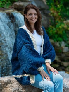 "Embrace the salty sea air with the Maine Cardigan! Hand-crafted using machine-washable, bulky wool-blend yarn, this cozy knit sweater is perfect for chilly spring mornings, brisk fall outings, or relaxing winter nights in. Featuring a long, oversized fit with roomy balloon sleeves, this stylish sweater provides comfort without sacrificing fashion. Its deep blue and white piping makes this cardigan the ultimate nautical touch, whether you pair it with jeans and a turtleneck, a flowy skirt with stockings, or your favorite overalls. No matter the outfit, no matter the season, the Maine Cardigan brings a touch of the coast to any wardrobe. Cardigan Measurements: Body Length: 29.5 in (74.5 cm) Body Width: 28 in (71.5 cm) Sleeve Length: 17 in (42 cm) The pictured model is 5' 9\" Material: Knit Chunky Cardigan Outfit, Skirt With Stockings, Fall Outings, Stylish Sweater, Cozy Knit Sweater, Chunky Cardigan, Stylish Sweaters, Cardigan Outfits, Winter Nights