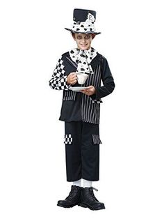 a boy in a costume holding a coffee cup and wearing a top hat with polka dots