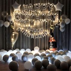 a birthday party with balloons and lights