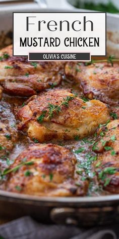 chicken is cooking in a skillet on the stove with herbs and spices around it