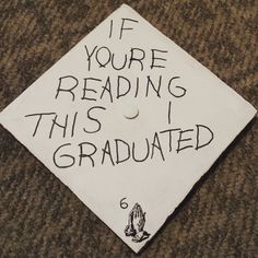 a graduation cap with writing on it that says if you're reading this i graduated