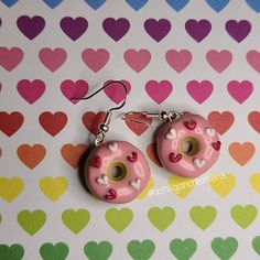 Valentine Donut Earrings Donuts measure approximately between 1.5cm to 2.25cm Materials: ▫ Polymer Clay ▫ Hypoallergenic Hanging Earring Hook Each Donut is handmade by me, so you may receive a pair of earrings that are slightly different from the ones pictured in the listing. As they are all made by hand all are similar but no two pairs will ever be the same! I can also do custom orders. Please feel free to send me a message with any questions or ideas! Thanks for checking out my shop! Cute Nickel-free Round Hoop Earrings, Cute Hypoallergenic Round Hoop Earrings, Cute Nickel-free Small Hoop Earrings, Cute Small Hoop Nickel-free Earrings, Cute Small Hoop Pink Jewelry, Pink Small Hoop Earrings In Cute Style, Cute Handmade Round Earrings, Cute Handmade Small Hoop Earrings, Pink Circle Earrings As A Gift