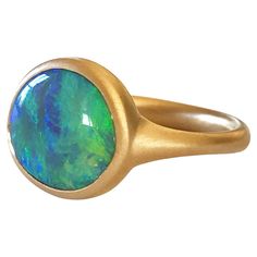 Dalben design 18k yellow gold satin finishing ring with a 3,05 carat bezel-set round-oval shape Australian crystal opal from Lighting Ridge mine . The opal has wonderful and deep blue green light spots. Ring size US 6 3/4 - EU 54 re-sizable to most finger sizes. Bezel setting dimension: width 13,2 mm, height 12 mm. The ring has been designed and handcrafted in our atelier in Italy Como with a rigorous quality workmanship . Italy Como, Australian Lighting, Opal Ring Gold, Crystal Opal, Gold Satin, Delicate Rings, Opal Crystal, Opal Rings, Bezel Setting