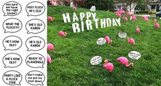 pink flamingos sitting in the grass next to a yard sign that says happy birthday