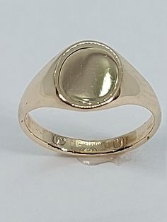 Welcome to my shop! This stunning kids signet ring has been made from scratch in 10K Yellow Gold. Great for any occasion! Treat your-self or buy it for the special person in your life! I can resize this ring at no extra cost and will ship it to you in an elegant gift box. A tracking shipping number will be provided to you once ring has been mailed. Ring Measurements: Ring Weights 1.5 Grams Ring Measurements: Face of the Ring is 8.50 mm x 6.5 mm  Ring Band: 2.00 mm Size: 2 3/4 Know a little bit o Adjustable Polished Signet Ring, Yellow Gold Signet Ring With Bezel Setting As Gift, Yellow Gold Bezel Set Signet Ring As Gift, Adjustable Round Signet Ring Stamped 14k, 14k Gold Rounded Signet Ring For Gift, Adjustable Round Signet Ring, Adjustable Round 14k Stamped Signet Ring, 14k Gold Hallmarked Birthstone Ring, Yellow Gold Signet Ring With Hallmarks