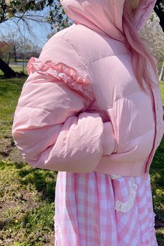 This super-cute pastel pink puffer features puffy bear ears, a gold zipper and buttons, and ruffle detailing on the sleeves. The Pink Marshmallow Bear Puffer is light enough for a cool Spring day and like the name implies - it's super fluffy like a marshmallow! Perfect for a day in the park or running errands in style. Model wearing size S. Pink Quilted Puffer Jacket For Winter, Fluffy Pink Outerwear For Spring, Fluffy Pink Spring Outerwear, Pink Quilted Puffer Jacket For Fall, Trendy Pink Fluffy Outerwear, Spring Puffy Outerwear, Pink Long Sleeve Puffer Jacket With Zipper Closure, Pink Winter Puffer Jacket With Zipper, Pink Zipper Closure Outerwear For Spring