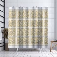 a bathroom with a shower curtain that has an abstract design on the front and side