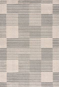 an area rug with grey and white squares on it