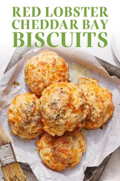 red lobster cheddar bay biscuits on a plate with a knife and fork next to it