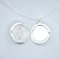 The perfect spot to keep your loved ones close. This classic round locket is finished in highly polished 925 Sterling Silver and is stamped in an intricate circular pattern. Will hold photos or small momentos, a classic gift idea! Includes a smooth, 18 inch snake chain. Chain: 18 inch sterling silver Plated(stamped) Material: 925 sterling silver plated Size: 3cm (Approximately 1.25 inches) Comes in a gift box (Original Price $34.95) Locket Necklace Heart, Pocket Necklace, Necklace Heart Locket, Silver Heart Locket, Sterling Silver Locket Necklace, Heart Shaped Locket, Silver Locket Necklace, Round Locket, Sterling Silver Locket