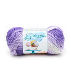 purple and white yarn ball with ice cream on the top, in front of a white background