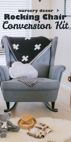 a rocking chair with a black and white blanket on top of it next to a teddy bear