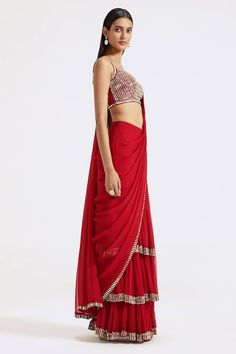 Red pre-draped saree with contrast cutdana beaded border. Paired with a padded silk blouse with all over mirror and zari embroidery. - Aza Fashions Red Pre-draped Saree For Party, Red Pre-draped Saree With Sheer Dupatta For Puja, Fitted Red Pre-draped Saree With Sheer Dupatta, Red Pre-draped Saree With Cutdana, Red Cutdana Pre-draped Fitted Saree, Draped Saree For Evening Festivals, Evening Saree For Festivals, Draped Style, Fitted Red Pre-draped Saree With Cutdana, Red Fitted Pre-draped Saree With Cutdana