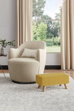 a chair and ottoman in front of a window