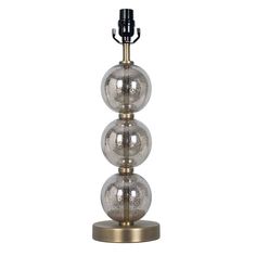 three glass balls on a metal stand with a black lamp in the middle and one silver ball at the top