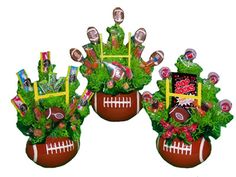 two football planters filled with candy and candies