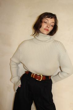 The Montana Pima Cotton Turtleneck boasts a traditional rib design that will serve as a staple in your wardrobe. Crafted with longevity in mind, this turtleneck is made a warm and durable ribbed fabric, ensuring a timeless and sophisticated look. Classic Turtleneck With Ribbed Collar, Classic Funnel Neck Turtleneck With Ribbed Collar, Classic Ribbed Sweater, Classic Turtleneck With Ribbed Collar For Work, Classic Ribbed Winter Tops, Classic High Neck Sweater For Workwear, Classic High Neck Sweater For Work, Classic Ribbed Turtleneck For Workwear, Classic Beige Fitted Turtleneck