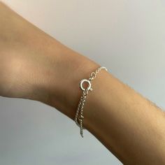 Our Capeology Cape Cod bracelet lets you wear this special place wherever you go. This piece is made out of sterling silver and is available in silver, gold, or rose gold. The chain is adjustable and has the option to be worn at 7.0, 7.5, or 8.0 inches in length. The back of the bracelet is engraved with "CAPEOLOGY." Check out our new two-toned Cape Cod bracelet here (pictured top bracelet in first photo)! For many, Cape Cod is not just a place, it's a memory, a smell, a sound. No matter if you' Adjustable Sterling Silver Bracelets With Extender, Adjustable White Gold Jewelry For Everyday Wear, Dainty Charm Bracelet With Adjustable Chain, Dainty Jewelry With Adjustable Length, Sterling Silver Bracelet With Extender, Minimalist Sterling Silver Jewelry With Adjustable Length, Silver Dainty Bracelet With Extender, Adjustable Silver Chain Friendship Bracelet, Dainty Adjustable Sterling Silver Bracelet Nickel Free