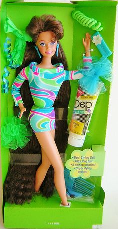 a barbie doll in a green box with hair