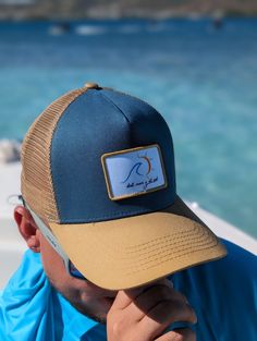 Embrace the perfect blend of style and comfort with our "Mar y Sol" Trucker Hats. Tailored for outdoor enthusiasts, these caps feature breathable mesh for coolness and a curved visor for sun protection. Whether sailing the seas or roaming the urban landscape, the distinctive "Mar y Sol" badge connects you with the spirit of nature and adventure. Available in two appealing colors: navy blue and beige, these hats are the ideal accessory for your next outdoor venture. Mesh Cap, Urban Landscape, The Urban, Sporty Style, Trucker Hats, Sun Protection, Trucker Hat, Sailing, Dark Blue