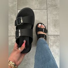 Stay On Top Of The Latest Fashion And Trends With These Stylish Platform Sandals! With A Platform Height Of 1.5 Inches And A Heel Height Of 1.75 Inches, You'll Have Both Comfort And Style. The Double Adjustable Buckle Strap Design Adds A Trendy Touch, While The Easy Slip-On Style Makes Them Perfect For Any Occasion. Perfect For Your Next Vacation Or Beach Day. Upgrade Your Look Today! Faux Leather Upper Slip On Open Toe Platform Sole Textured Rubber Outsole Adjustable Buckle Straps Tags: Double Black Platform Sandals, Black Slides, Upgrade Your Look, Buckle Sandals, Strap Design, Lug Sole, Sandals Summer, Beach Day, Slide Sandals