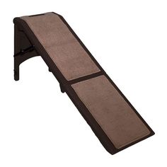 a brown and black dog ramp on a white background with the bottom section open to show it's side