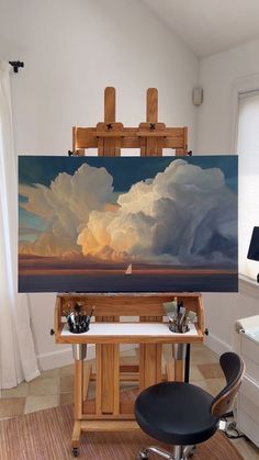 an artist's easel with a painting on it