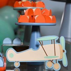 an airplane themed birthday party with orange and blue decorations