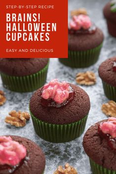 chocolate cupcakes with red frosting and nuts on top