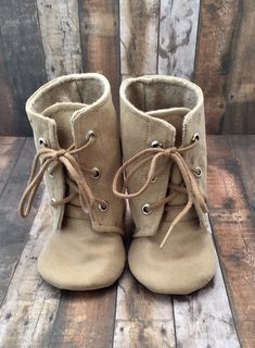 "BOOT SIZING: (Please allow for at least 1/4\" allowance when choosing a size for wiggle room) Newborn (3.5\") 3-6 Month (4\") 6-12 Month (4.5\") 12-18 Month (5\") 24 M-3T (5.5\") These baby combat boots are made with tan fabric on the outside and soft felt on the inside for extra comfort. The laces are tan. NON-SLIP SOLES ($5 more) The non-slip is a flexible rubber-like material that is waterproof and great in hot/cold outside conditions. Wonderful for beginner walkers since it still allows the Tan Fabric, Types Of Packaging, Cold Outside, Lace Boots, Lace Up Boots, 2 Colours, Wedge Boot, Faux Suede, Combat Boots