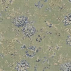 a blue and green floral pattern on fabric