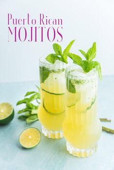 two glasses filled with lemonade and mint mojitos next to sliced limes