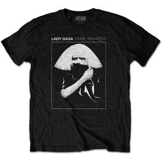 An official licensed Lady Gaga Unisex Tee featuring the 'Fame' design motif. This high quality t-shirt design is available in the black colorway. Classic unisex fit cotton music tee featuring short sleeves & crew neck. Lady Gaga Shirt, Lady Gaga T Shirt, The Fame Monster, Rock Band Tees, Music Tees, High Quality T Shirts, Lady Gaga, Vintage Tshirts, Black Tshirt