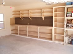 the empty room has many shelves and shelvings on it's walls,