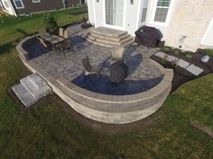 a patio with chairs and an umbrella on it