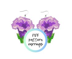 a pair of purple flowers with the words pop pattern earring on top of it