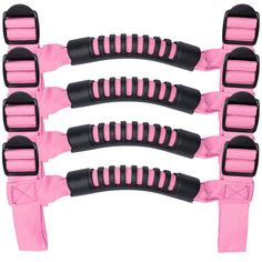 four pink and black handles on the back of a horse