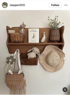 there is a shelf with baskets and hats on it