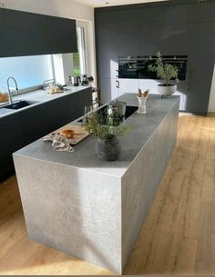 a modern kitchen with an island counter top